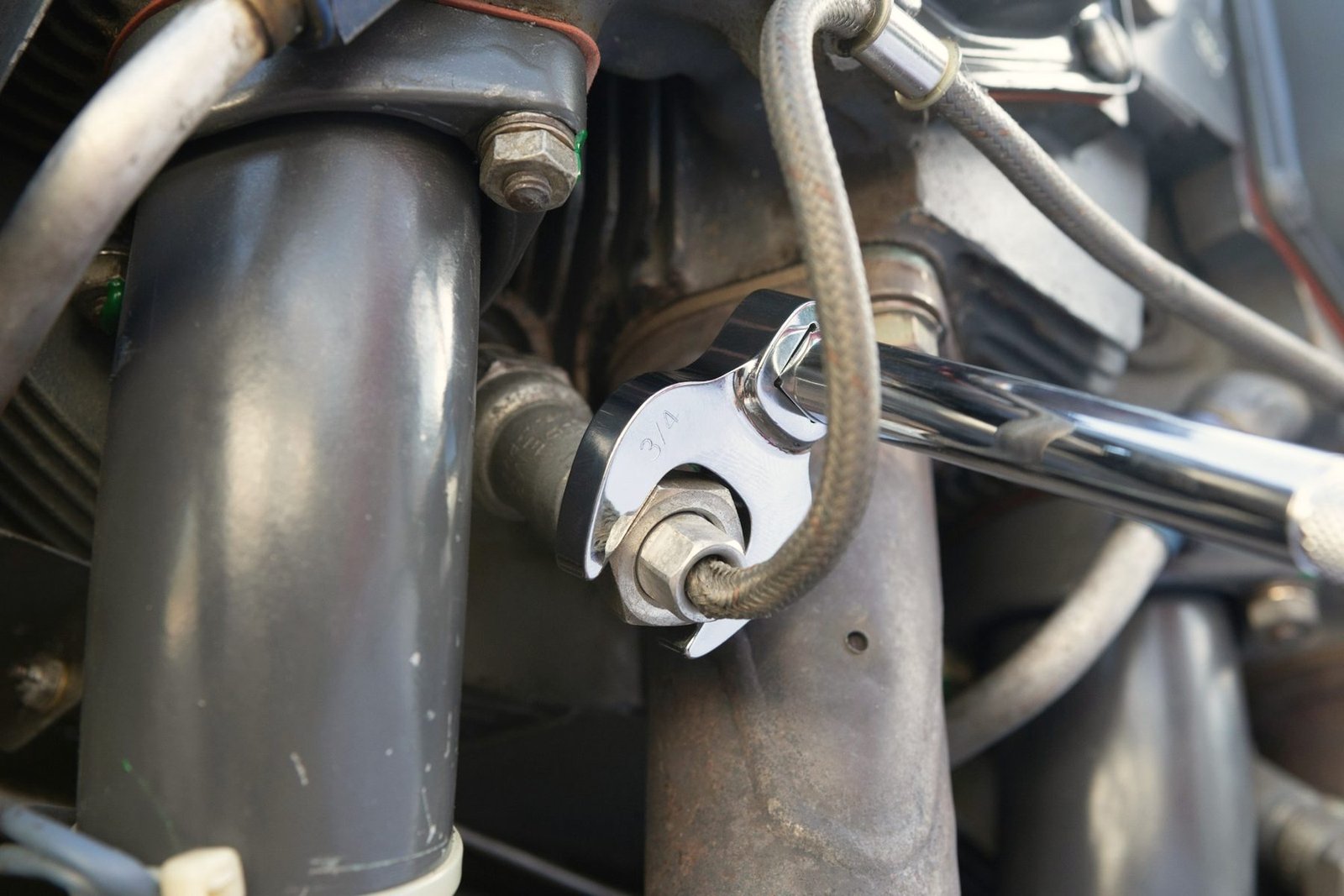 An open-end wrench on a line fitting